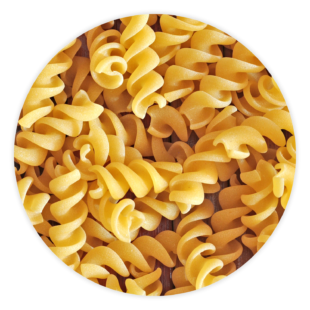 A pile of fusilli spiral pasta noodles.